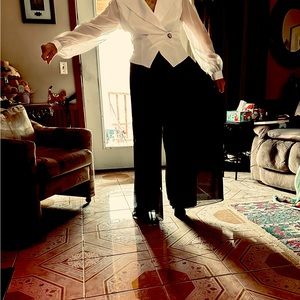 Black and white wear. Black slacks comfortably lined with shimmering overlay.